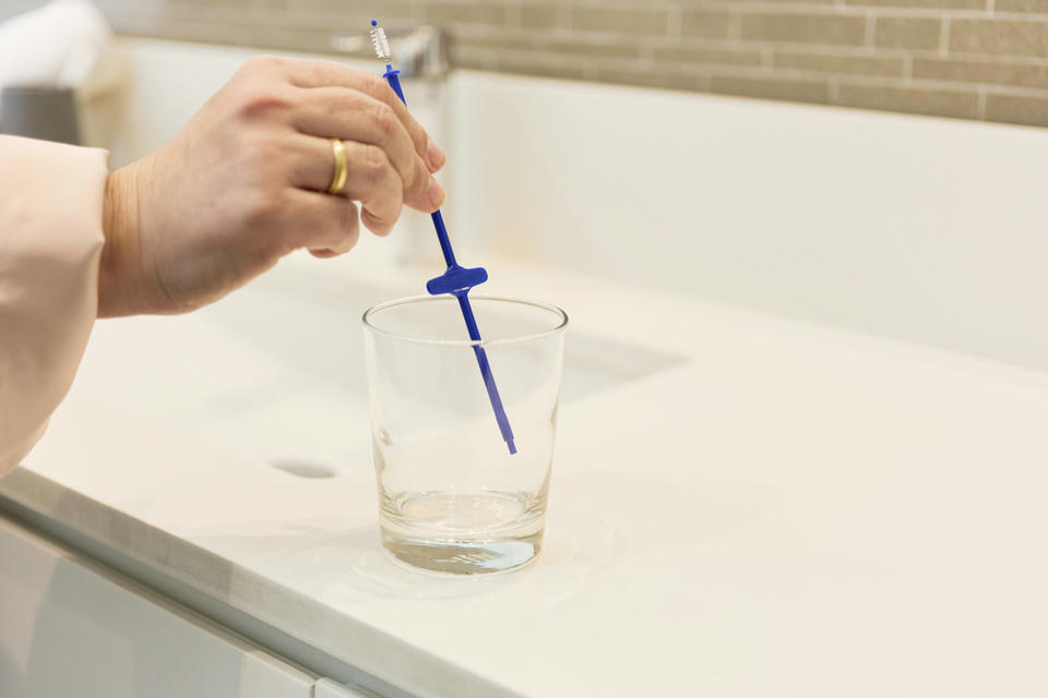 woman cleaning stoma maintenance