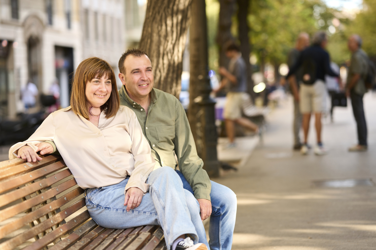 couple sitting outside woman with HME